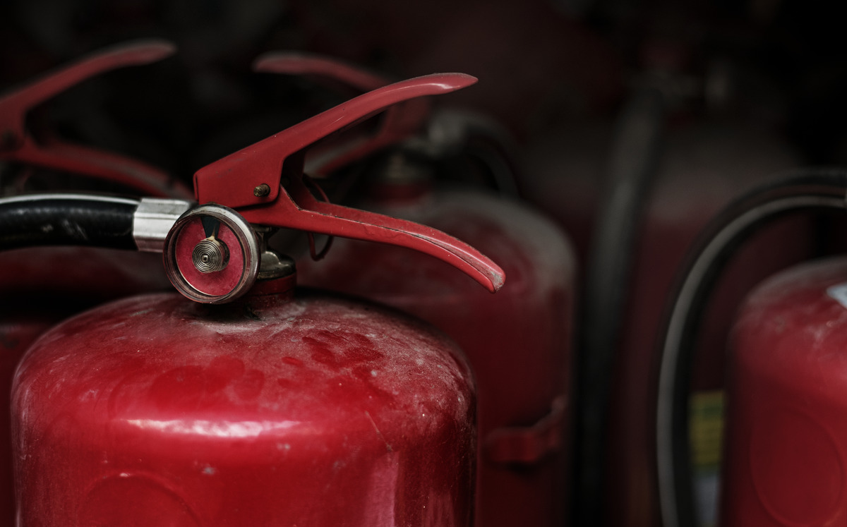 closeup red fire extinguishers 1